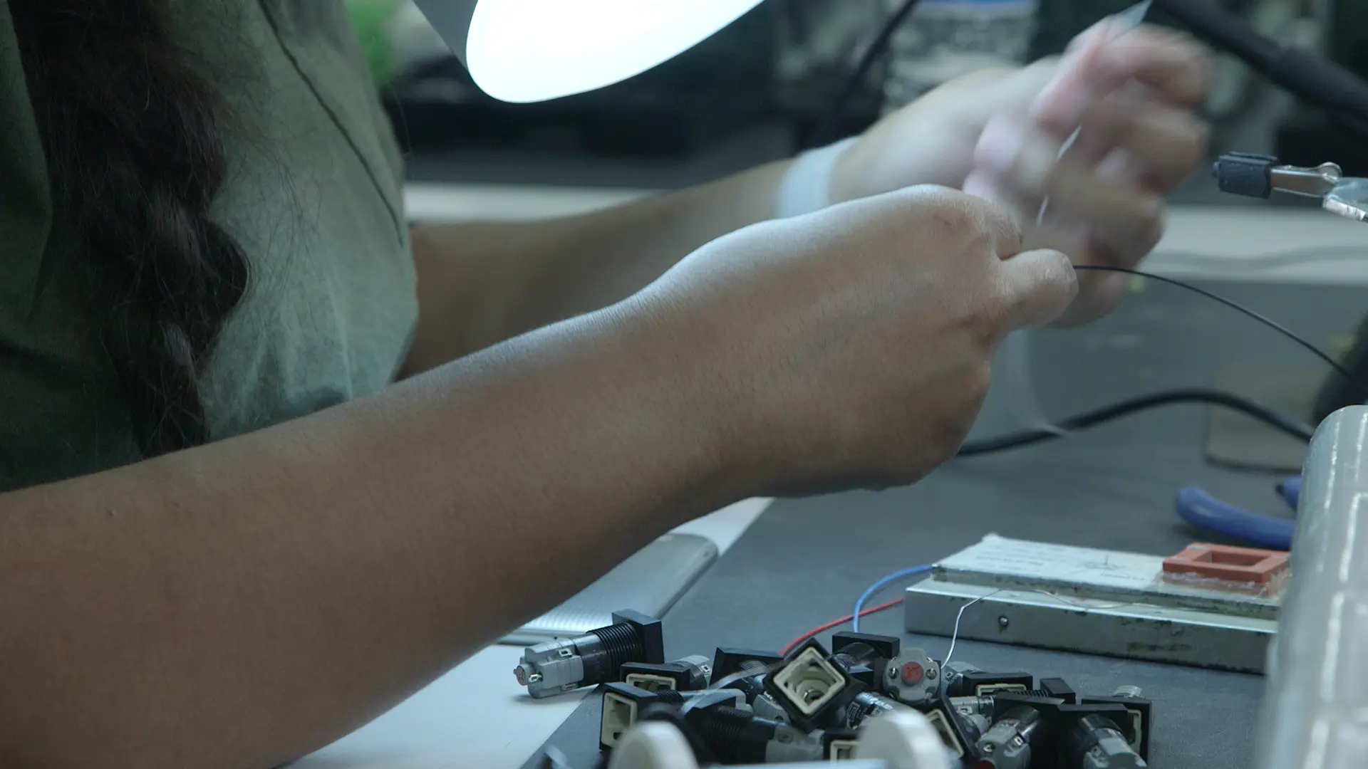 assembler at levison enterprises assembling cables and wires to a PCB board