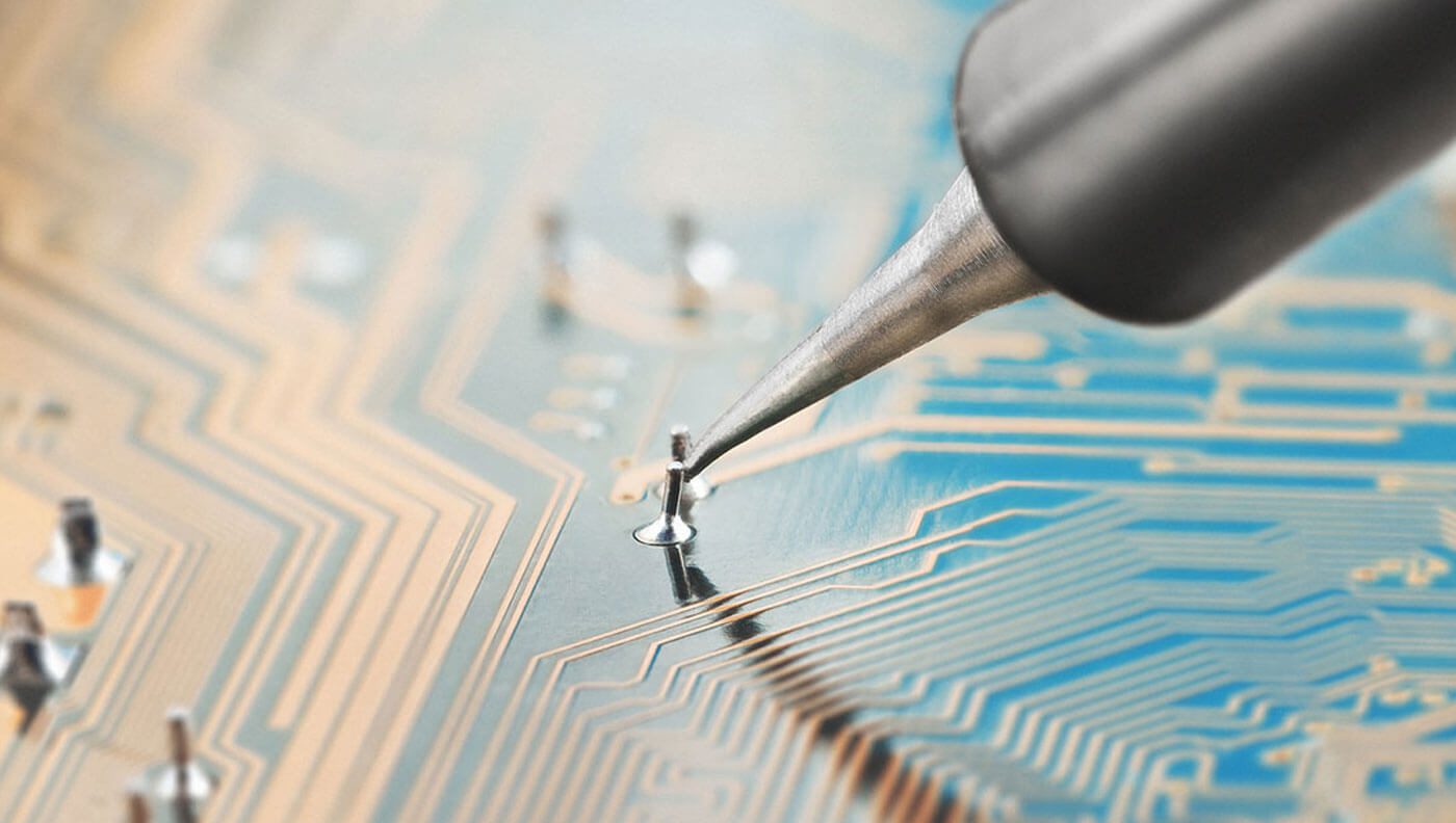 close up of sodering a pcb board