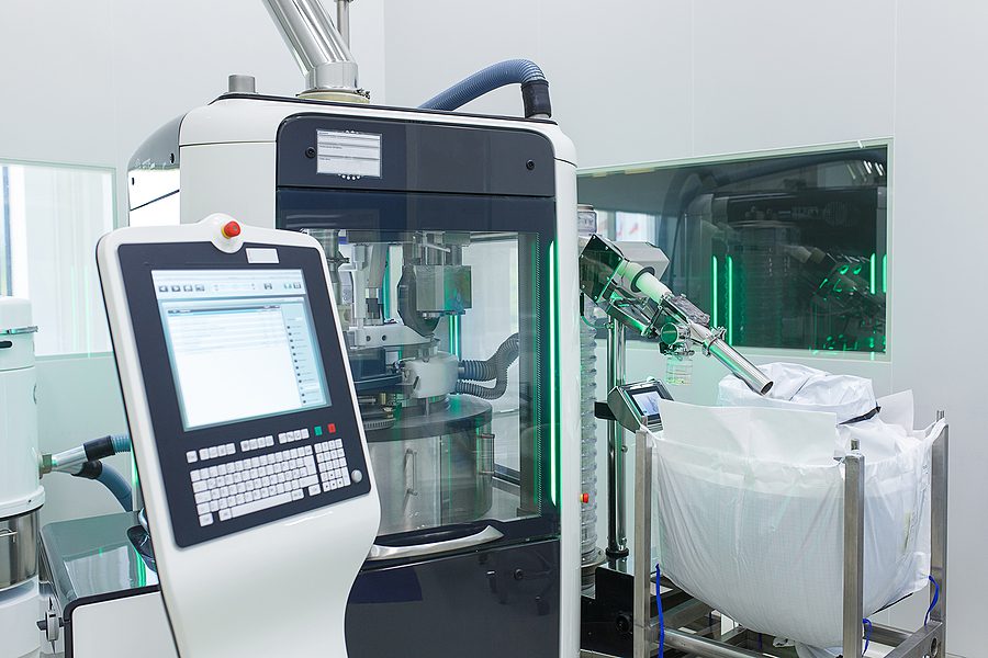 The room in the production laboratory with an electronic device for the manufacture and packaging of tablets. Study, development and production of medical products.