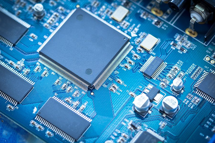 close up of Electronic circuit chip on blue pcb board