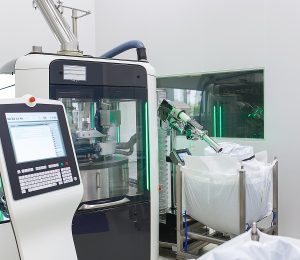 A room in the production laboratory with an electronic device for the manufacture and packaging of tablets. 