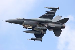 View of a fighter jet from the ground. 