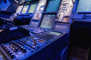 Detailed view of the upper set of switches in a large airliner.