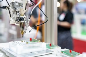 Closeup of printed circuit board assembly process